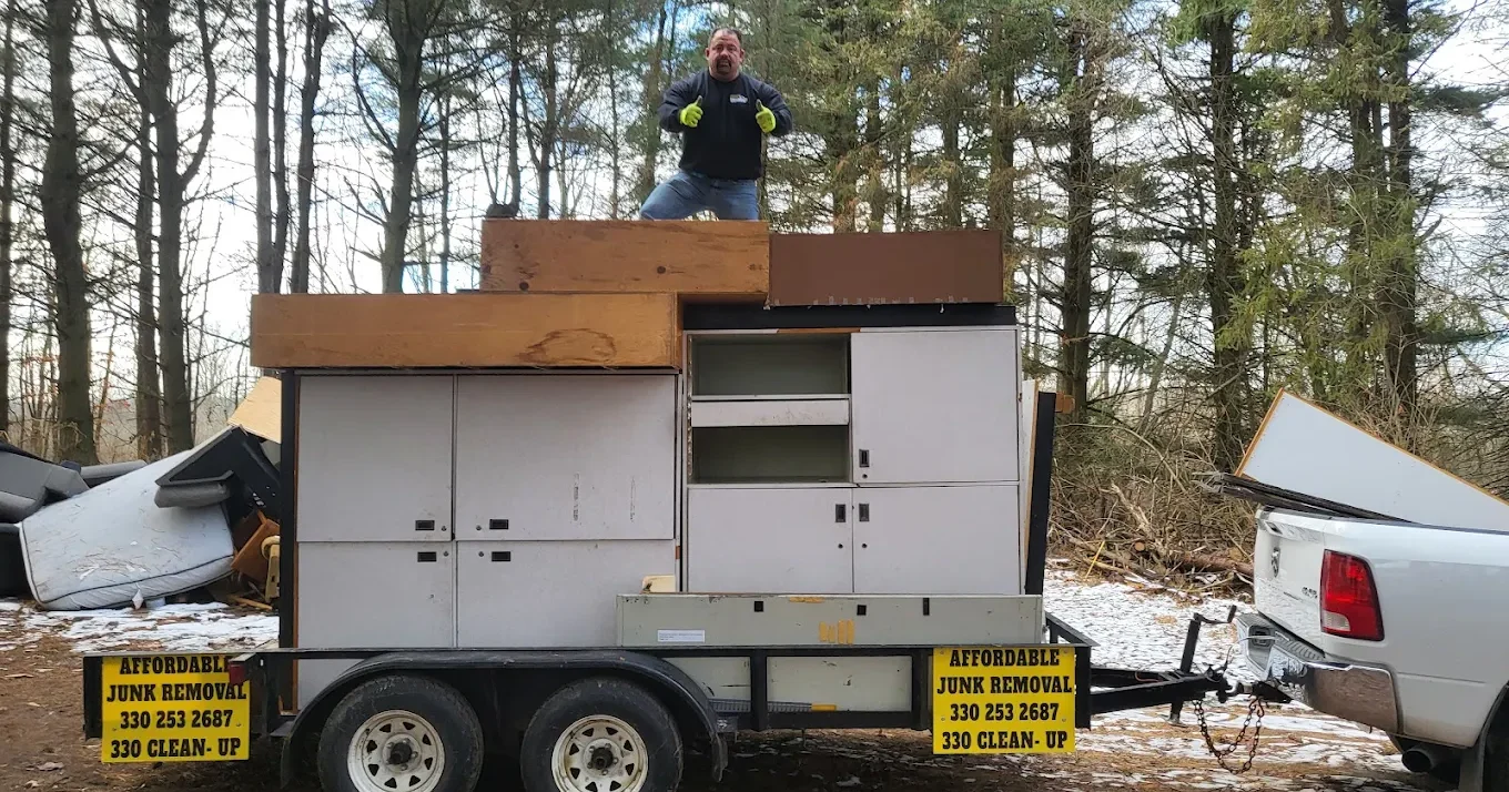 Professional junk removal team loading truck in Akron